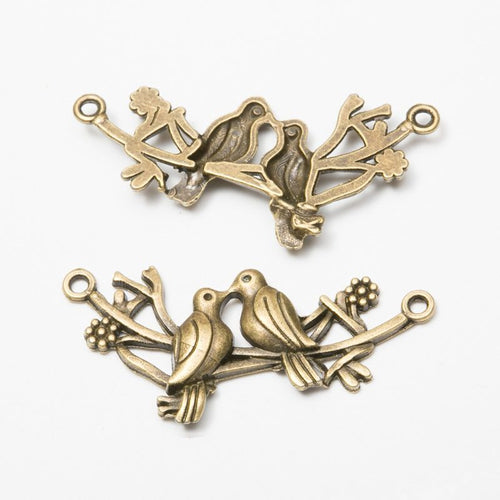 Front and reverse details of the birds on branch double loop metal connector