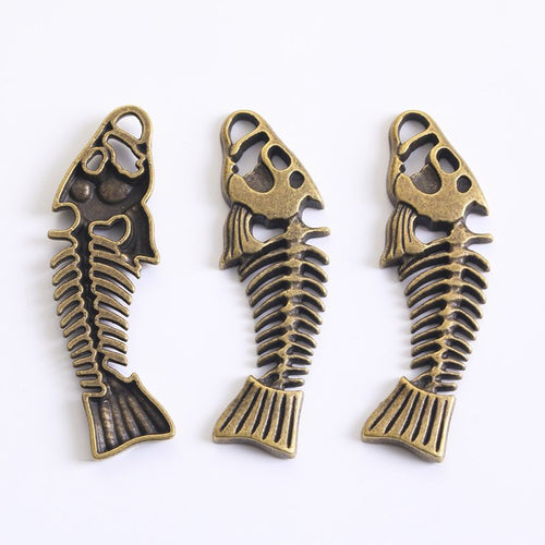 Long Fish Skeleton metal piece showing front-facing surface and relief detail