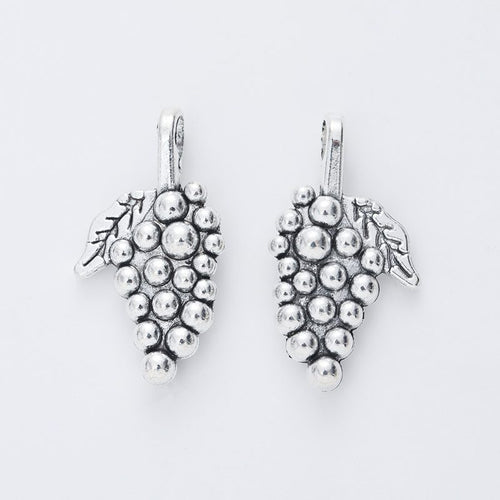 Closer view of the large grape cluster charm surface and hanging loop