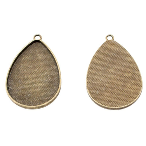 Front detail of teardrop recessed cabochon tray with a textured back