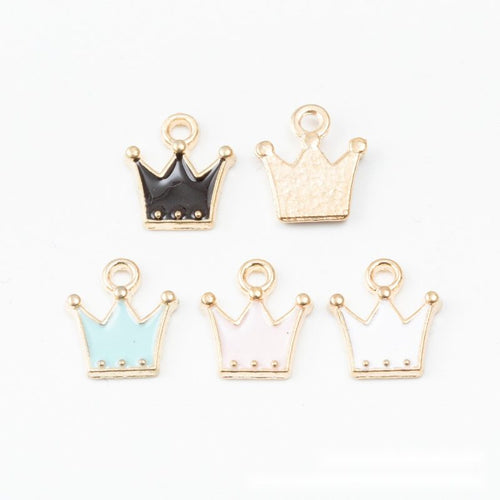 Close view of the a glossy five-point crown outlined in gold tone with three tiny raised dots