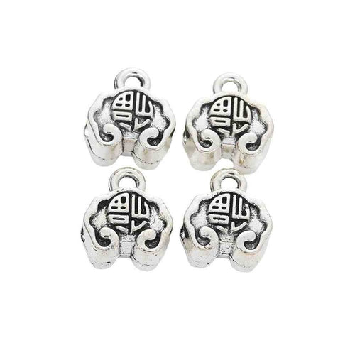 Rounded large-hole bead with a raised symbol and hanging loop shown in front detail view