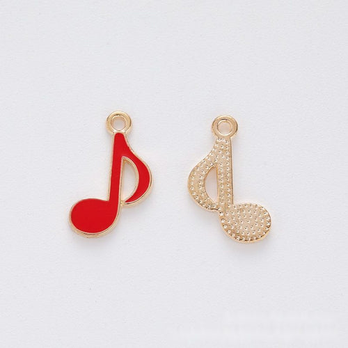Musical note metal component, front and reverse detail on white