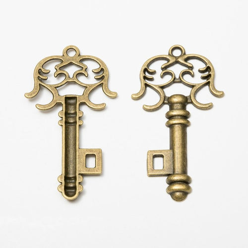 Close view of the scroll bow skeleton key showing a symmetrical scrollwork bow and compact shaft