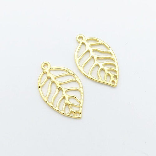 Close front view showing the shape and recessed details of the openwork leaf charms