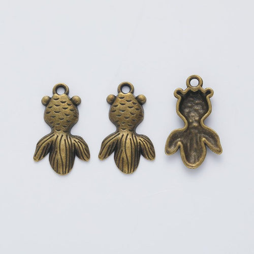 Closer view of the round-bodied goldfish charm surface and hanging loop