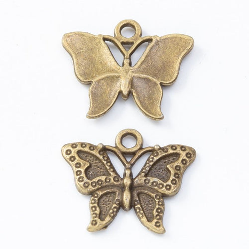 Front and reverse details of double sided butterfly charms on a white background