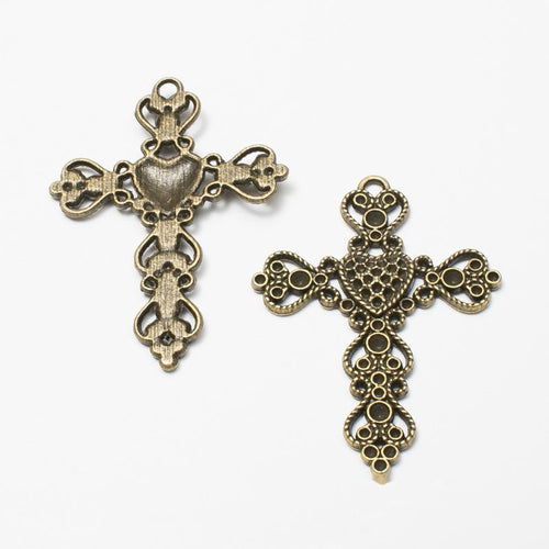 Front and reverse view of the ornate cross charm