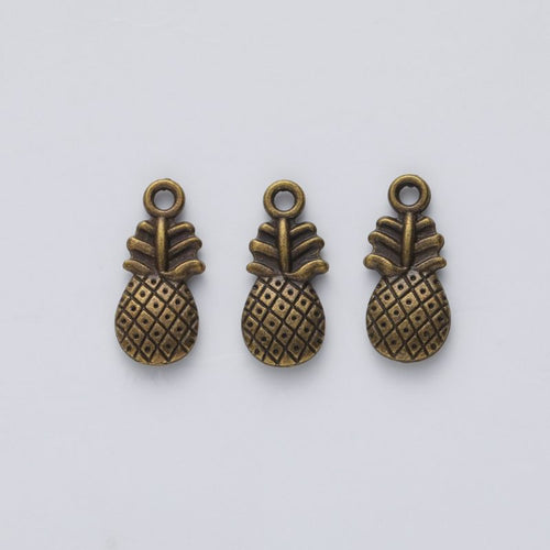 Closer view of the pineapple charm surface and hanging loop