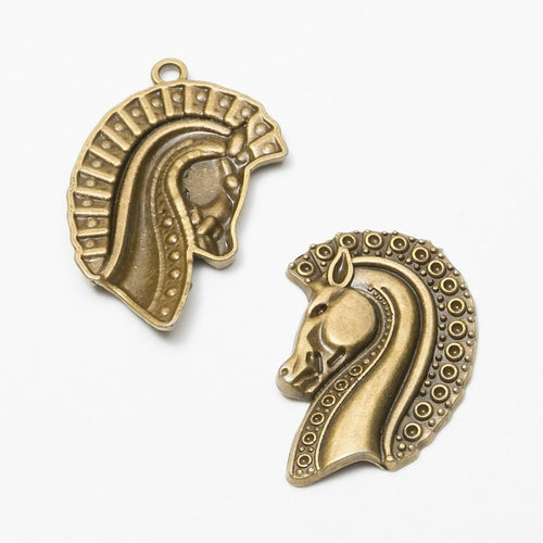 Close-up view of the decorative horse head metal charms in three finishes showing its front and reverse metal details.