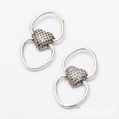 Front and reverse details of double loop heart connectors on a white background