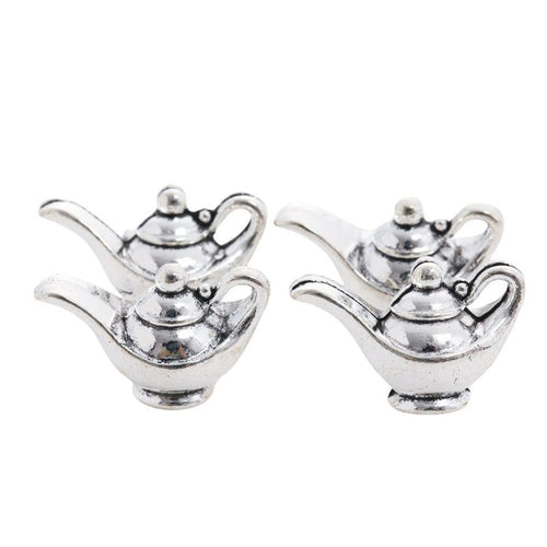 Grouped front and back views showing the details of floral teapot charms