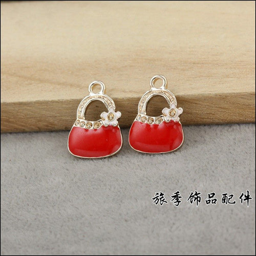Alternate image of handbag charm showing available finishes and form