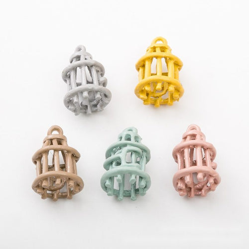 Assorted birdcage finishes arranged on a white background