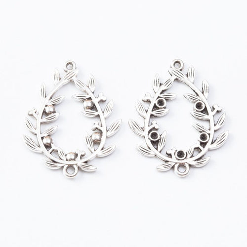 Close view of the relief and openwork details on the leaf wreath oval chandelier connector