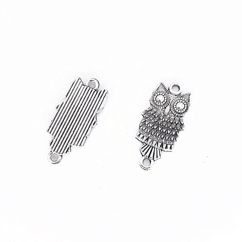 Long Feather Owl metal design front and back view on a light background