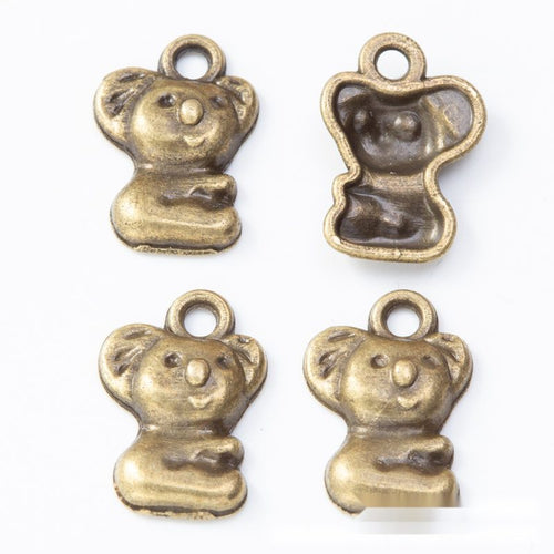 Alternate image of seated koala charm showing available finishes and form