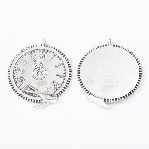 Front and reverse view of the swallow-decorated round clock face