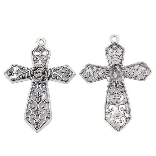Close view of the textured cross showing a flared cross silhouette and raised decorative texture
