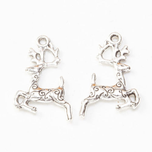 Close product view showing the front and reverse details of the leaping deer charm
