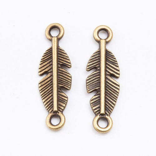 Close product view of the double loop feather connector charm in three metal finishes