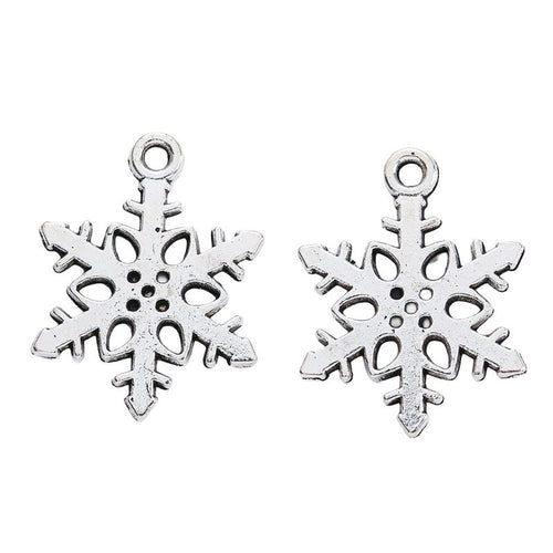 Alternate product view of cutout snowflake charms on a white background