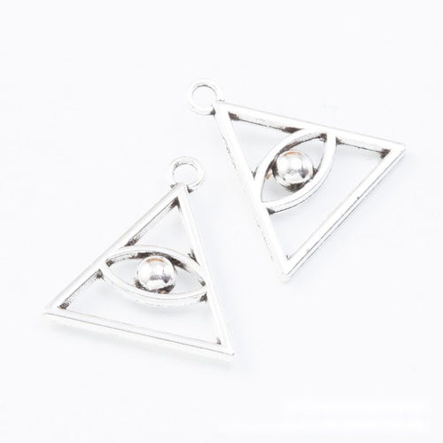 Close view of the triangle eye charm showing its raised front pattern