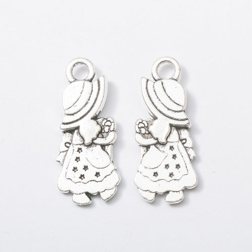 Close front and reverse view of the metal braided girl charm