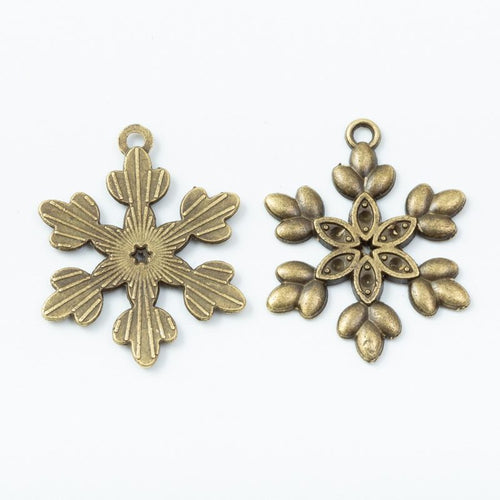Detailed Six Arm Snowflake Charm in an antique tone shown from the front