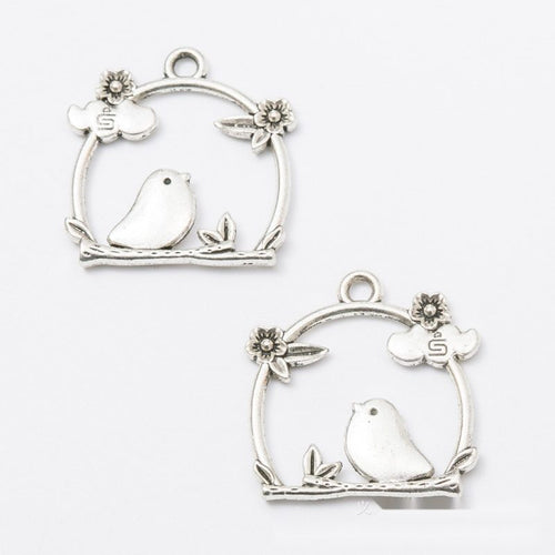 Close view of the bird in floral frame front and reverse