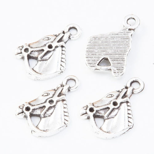 Horse Head metal component, reverse and front details on a white background.