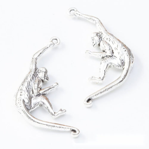 Curved monkey charms shown in product image 2