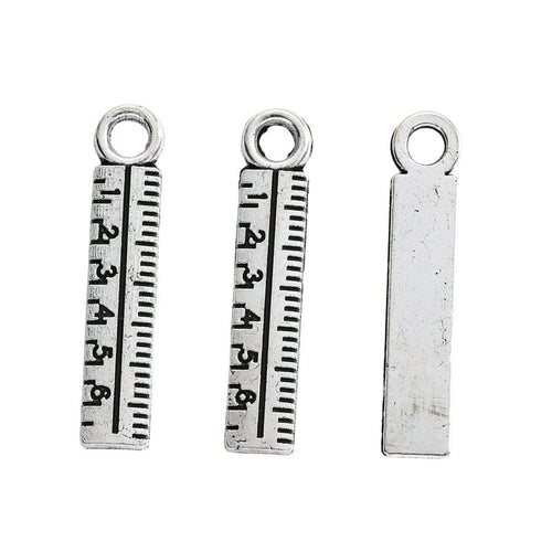 Alternate product view of ruler charms on a white background