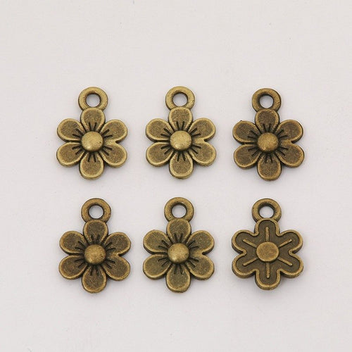 Close view showing the front details of the five-petal flower charms