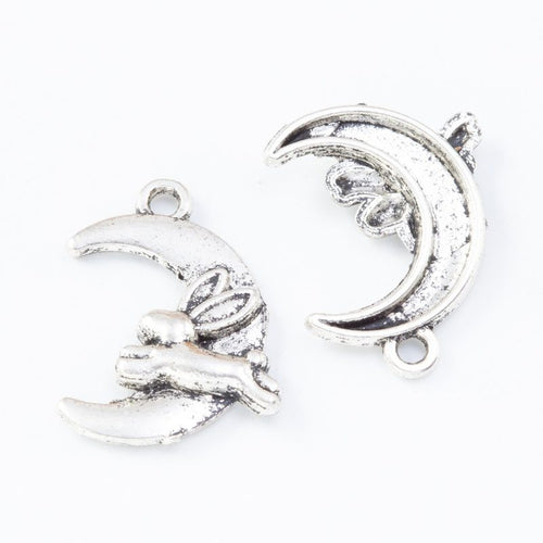 Front and reverse details of rabbit moon charms on a white background