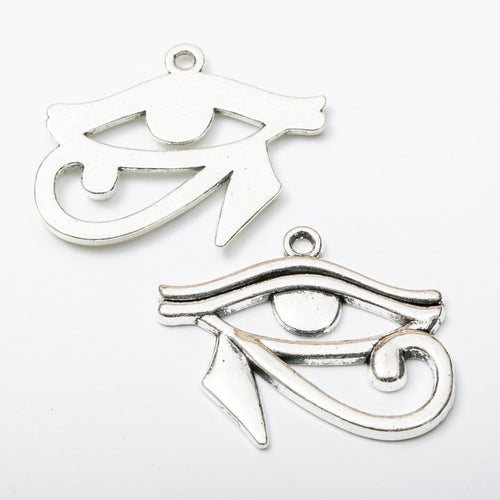 Close front and reverse view of the metal Eye of Horus charm