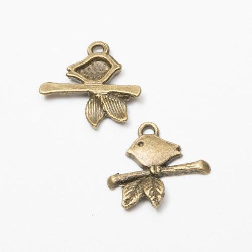 Front and reverse views of the bird on branch pair in one finish