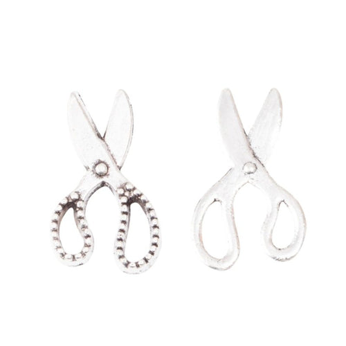 Angled detail views of scissors charms