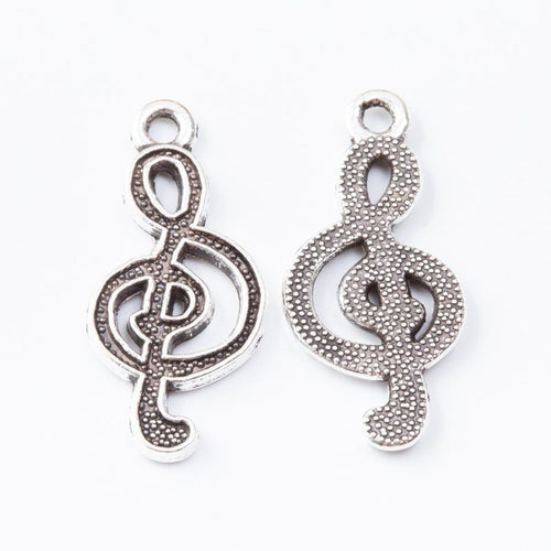 Closer view of the open treble clef silhouette with dotted reverse texture