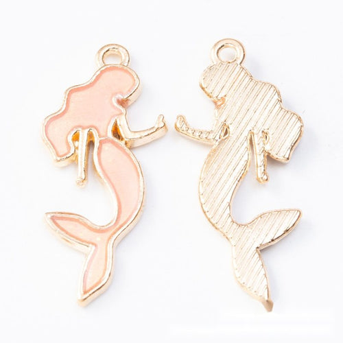 Front and reverse details of mermaid charms on a white background