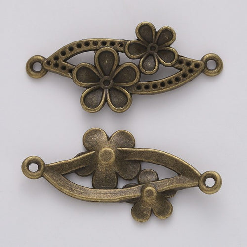 Floral Leaf Connector metal piece showing front-facing surface and relief detail