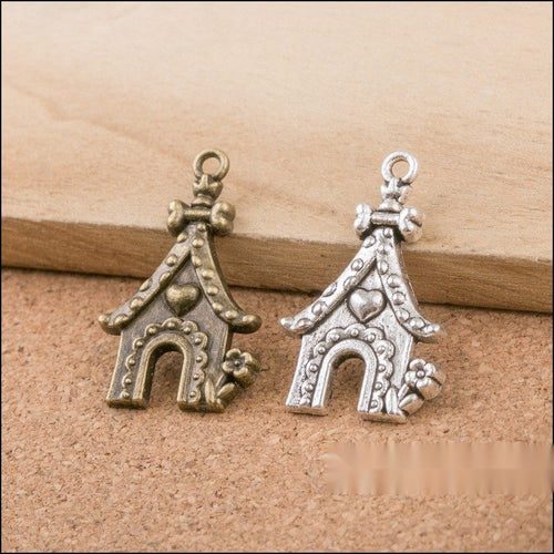 Close-up view of the heart detail doghouse metal charms in two finishes showing its front and reverse metal details.