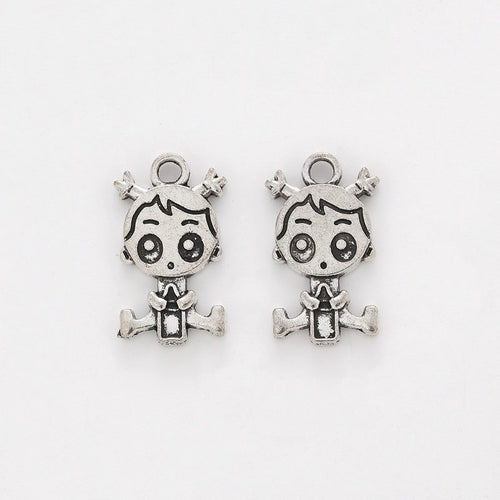 Closer view of the cartoon girl charm surface and hanging loop