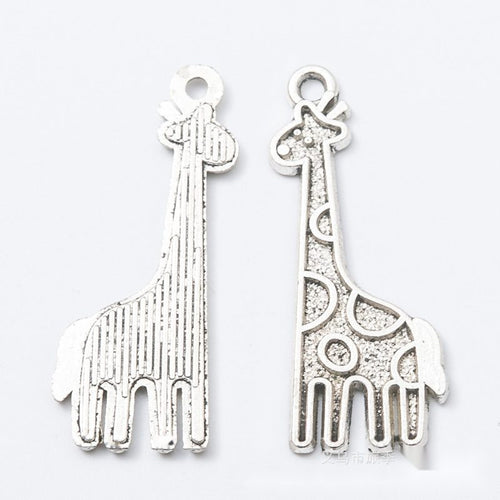 Close product view showing the front and reverse details of the tall giraffe charm