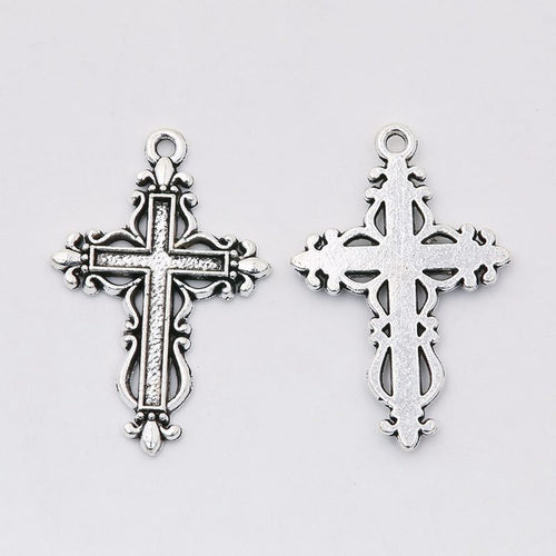 Front detail and finish comparison of the layered ornate cross charm