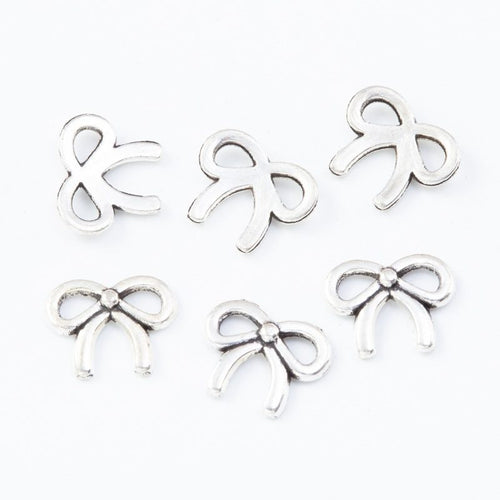 Front and reverse details of the tiny bow metal jewelry component
