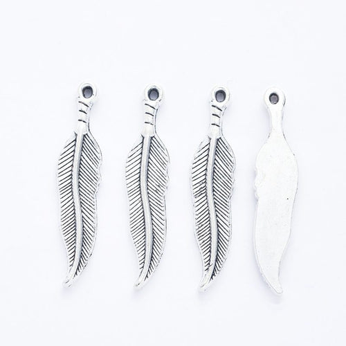 Alternate image of long feather charm showing available finishes and form