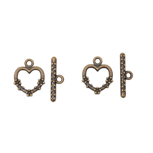 Close view showing the front and reverse details of the heart toggle clasp