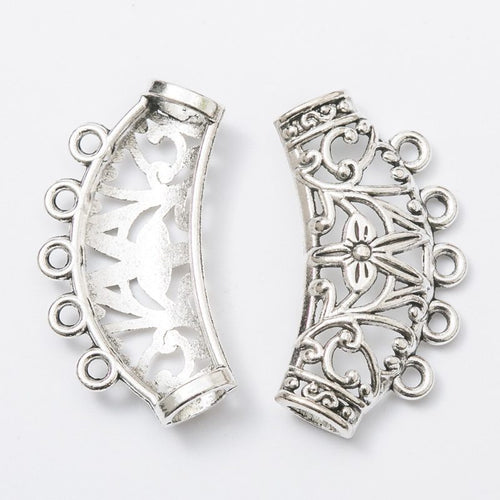 Close view of the relief and openwork details on the floral curved chandelier connector