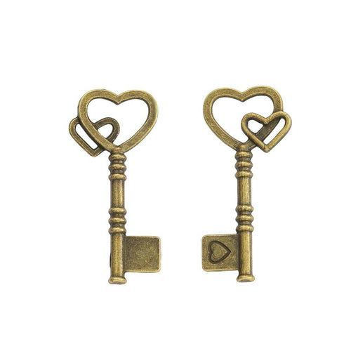 Close view of the double heart key showing two interlocking heart outlines above a slim shaft